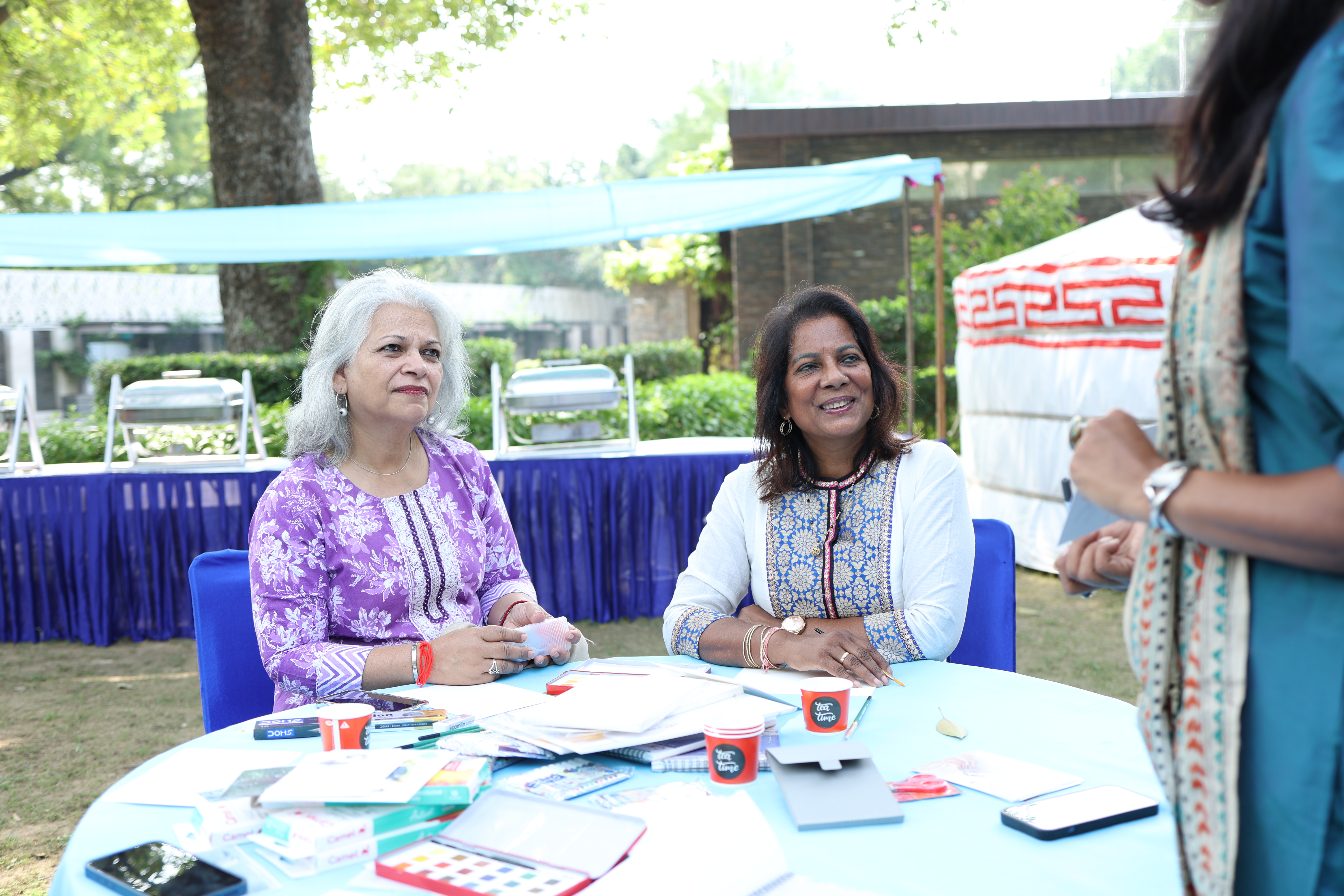 Buyers reviewing exhibitor materials